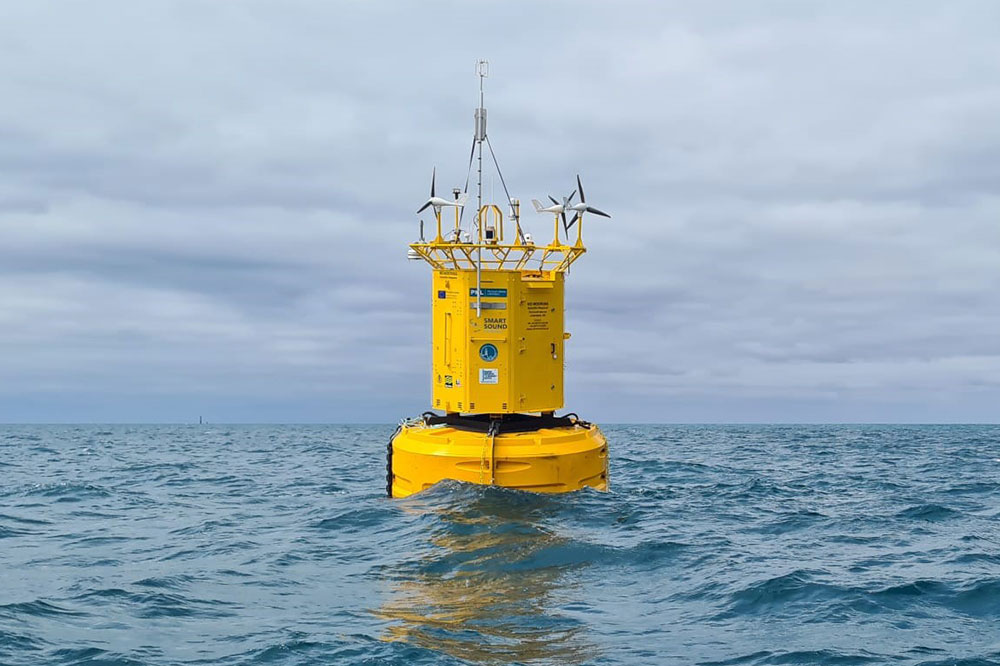 Yellow data buoy at sea